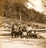 boat crew of African American men sitting on, and in front of, a fallen tree near the New River, West Virginia. Poster Print - Item # VARBLL0587632615