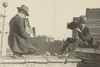Two photographers taking each others' picture with hand-held cameras while perched on roof Poster Print by unknown - Item # VARBLL058745962L