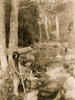 Man holding a spear while standing on rocks by a running stream Poster Print - Item # VARBLL058746930L