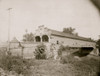 Double wooden bridge of the natural road at Cambridge, Ohio; view of a two-lane covered bridge spanning a river in Cambridge, Ohio. Poster Print - Item # VARBLL058751965L