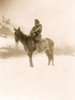 Apsaroke man on horseback on snow-covered ground, probably in Pryor Mountains, Montana. Poster Print - Item # VARBLL058747159L