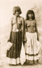 Two bare-breasted Yuma women posed, standing, full length, holding photos of men. Poster Print - Item # VARBLL058751208L