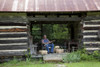 Basket weaver in Log Cabin Poster Print - Item # VARBLL058756348L