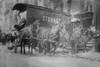 Horse Drawn Wagon with sign saying STORAGE unload the home content of a family being evicted from their home or apartment on New York's Lower East Side; Family sits on steps as beds are being removed. Poster Print by unknown - Item # VARBLL058745865L