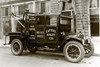 A photograph of an early tow truck.  Also called a "wrecker" is utility vehicle provided a wrecker service, body building, general inspecting, and towing. Poster Print by Unknown - Item # VARBLL0587228229