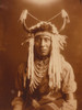 Half-length portrait of a Native man, wearing headdress, facing front. Poster Print - Item # VARBLL058747088L