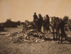 Three Navajos with horses, gathered before mound of rocks and vegetation. Poster Print - Item # VARBLL058747078L