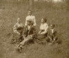 African American family posed for portrait seated on lawn Poster Print - Item # VARBLL058763250x
