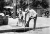 Agents Pouring liquor down a sewer on the Street Poster Print - Item # VARBLL058746207L
