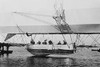 Men inside basket of Zeppelin airship, on water Poster Print by unknown - Item # VARBLL0587234113