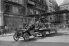 Biplane with spinning propeller is towed by an automobile down Fifth Avenue New York for July 4th Parade Poster Print by unknown - Item # VARBLL058745823L