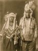 Piegan husband and wife, three-quarter length portrait, facing front. Poster Print - Item # VARBLL058747675L