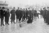 Policeman and other spectators watch Curling in Central Park with Men having Brooms at the ready over the ice. Poster Print by unknown - Item # VARBLL058746005L