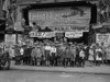 Children Take in a Theatre Presentation - "The Air Mail" - Douglas Fairbanks, also the presentation of "The Little Rascals" - Banner is draped across the Marquee of the Leader Theatre Poster Print - Item # VARBLL058746332L