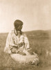 Piegan woman seated on ground in open field. Poster Print - Item # VARBLL058747614L