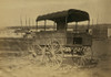 Covered wagon with side curtains rolled up at a military facility Poster Print - Item # VARBLL058745384L