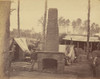 African American man standing beside a chimney in the deserted quarters of General Sharp at Brandy Station, Virginia. Poster Print - Item # VARBLL0587631597