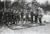 Reverent German Soldiers Stand With Shovels At The Grave Of The Commanding Officer. They Are With A Reconnaissance Unit In The Woods Of Dzuskawcza History - Item # VAREVCHISL037EC647