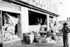 A Police Officer Inspects The Damage After The Riot In Watts History - Item # VAREVCHBDRIOTCS008
