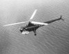 U.S. H-5G Helicopter_S Flying Over Water With A Patient In An Outboard Litter During The Korean War. Ca. 1950-53. History - Item # VAREVCHISL038EC173