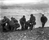 American Soldiers Help Others Whose Landing Craft Was Sunk Off Utah Beach On D-Day. The Survivors Reached The Beach Of Cherbourg By Using A Life Raft. June 6 History - Item # VAREVCHISL037EC197