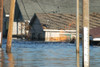 A Gas Fire Burns Next To A New Orleans Home Still Flooded A Week After Hurricane Katrina. Sept. 7 2005. History - Item # VAREVCHISL030EC044