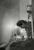 American Army Nurse At Candle Lit Bedside Of Wounded Soldier In France During World War 2. He Receives A Transfusion At A Front Line Hospital Indicating A Great Lose Of Blood From His Wound. Jan 23 History - Item # VAREVCHISL040EC379