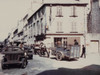 Cherbourg Street Traffic After Liberation From German Occupation. Local Civilian And Military Vehicles Crowd The Place De La Republique. June 27-30 History - Item # VAREVCHISL037EC237