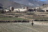 U.S. Soldier Walks Through A Field To Dahanah Village Wardak Province Afghanistan. Dec. 2 2010. History - Item # VAREVCHISL024EC152