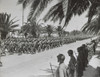 French Soldiers Marching In The Allied Victory Parade Along Avenue Gambetta. American Soldiers Standing At Parade Rest In The Foreground. May 20 History - Item # VAREVCHISL036EC652