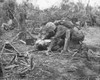 A Wounded U.S. Marine Takes Is Given Water While Waiting For Stretcher-Bearers To Come For Him. Peleliu Island. Sept.-Nov. 1944. World War 2 History - Item # VAREVCHISL036EC706