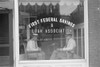 Two Businessmen Sit Behind The Storefront Window Of A Marion History - Item # VAREVCHISL033EC189