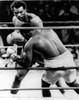 George Foreman- The Boxer Knocking Joe Frazier Down In The Second Round. Kingston History - Item # VAREVCHBDGEFOCS001