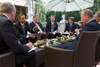 President Obama And Russian Prime Minister Vladmir Putin At A Breakfast Meeting In Moscow. On Obama'S Left Is National Security Advisor Marine General Jim Jones. July 7 2009. History - Item # VAREVCHISL026EC269