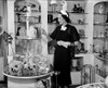 Mrs. Claude Pepper Wife Of The Democratic Senator From Florida Admiring A Glass In A Shop On Connecticut Avenue. July 27 1937. History - Item # VAREVCHISL023EC289