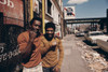 Smiling African American Men On A Garbage Strewn Street On The South Side Of Chicago. Ca. 1975. History - Item # VAREVCHISL031EC245