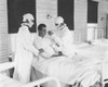 Spanish Flu Epidemic 1918-1919 In America. Masked Medical Personnel Giving Treatment To An Influenza Patient At The U.S. Naval Hospital History - Item # VAREVCHISL043EC683