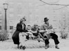 An African American Family On A Park Bench In An Urban Neighborhood. Ca. 1942. History - Item # VAREVCHISL012EC107
