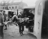 American Medics Place An Almost-Dead German Slave Laborer In An Ambulance At Nordhausen. U.S. 3Rd Army Liberated The Camp On April 12 History - Item # VAREVCHISL037EC321