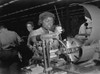 African American Woman Lathe Operator At A Midwest Supercharger Plant. In The Background Are White Workers In The Racially Integrated Workforce During World War 2. Ca. 1942-45. History - Item # VAREVCHISL036EC817