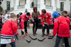 Michelle Obama Holds A 'Let'S Move ' Hockey Event. Washington Capitals' Mike Green And Chicago Blackhawks' Patrick Sharp Drop A Ball To Start A Street Hockey Game On The White House South Lawn. March 11 2011. History ( x - Item # VAREVCHISL027EC092