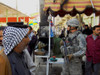 Us Soldier Patrols The Streets Of Martyrs Market As Local Nationals Shop In Mahmudiyah Iraq A Sunni Iraqi City South Of Baghdad Which Was A Center Of Insurgency During The Occupation Of Iraq. March 13 2007. History ( - Item # VAREVCHISL027EC208