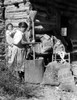 Cherokee Indians-Cherokee Indian Woman Cooking A Meal On The Qualla Reservation In The Great Smokey Mountains. - Cpl ArchivesEverett Collection History - Item # VAREVCHBDCHINCL003