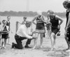 A Beach Official Checks The Amount Of Thigh Exposed By A Young Ladies Bathing Suit In 1922. The Hemlines On All Women'S Clothing Reached New Heights In The 1920'S. History - Item # VAREVCHISL002EC207