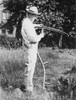 President Calvin Coolidge Sharpening A Scythe On His Farm In Vermont. History - Item # VAREVCHISL002EC014