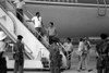 U.S. Air Force Security Police Guard Cuban Nationals As They Board The Airliner Returning Them To Cuba. Grenada'S Leftist Government Had Invited Cubans To Assist Their Construction Of A New International Airport. - Item # VAREVCHISL023EC150