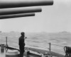 A Sailor On A Warship Keeps Alert Watch Over Merchant Ships In A Convoy. U.S. Warships Protected Convoys Of 30 To 70 Ships On The Atlantic During World War 2. Ca. 1941-45. History - Item # VAREVCHISL036EC938