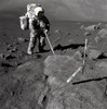Apollo 17 Geologist-Astronaut Harrison Schmitt Covered With Lunar Dirt. Schmitt Scoops Up Lunar Samples. Placed In The Foreground Is A Color Scale Of Blue History - Item # VAREVCHISL034EC084
