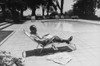 Richard Nixon Reading Newspapers While Sitting By The Pool In San Clemente. Ca. 1969-74. History - Item # VAREVCHISL032EC175