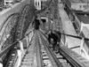 A Workman Greases Up The Tracks Of The Cyclone Roller Coaster In Coney Island. New York City History - Item # VAREVCHBDNEYOCS081